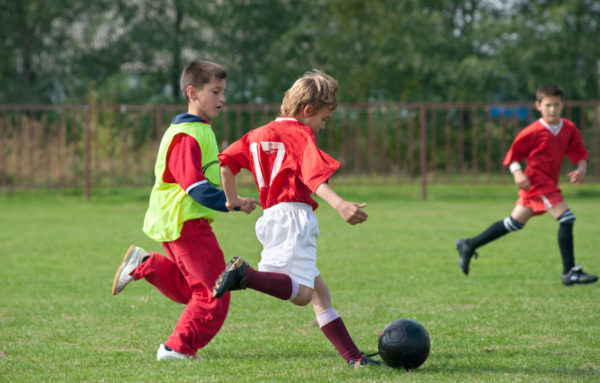 Children Playing Football.